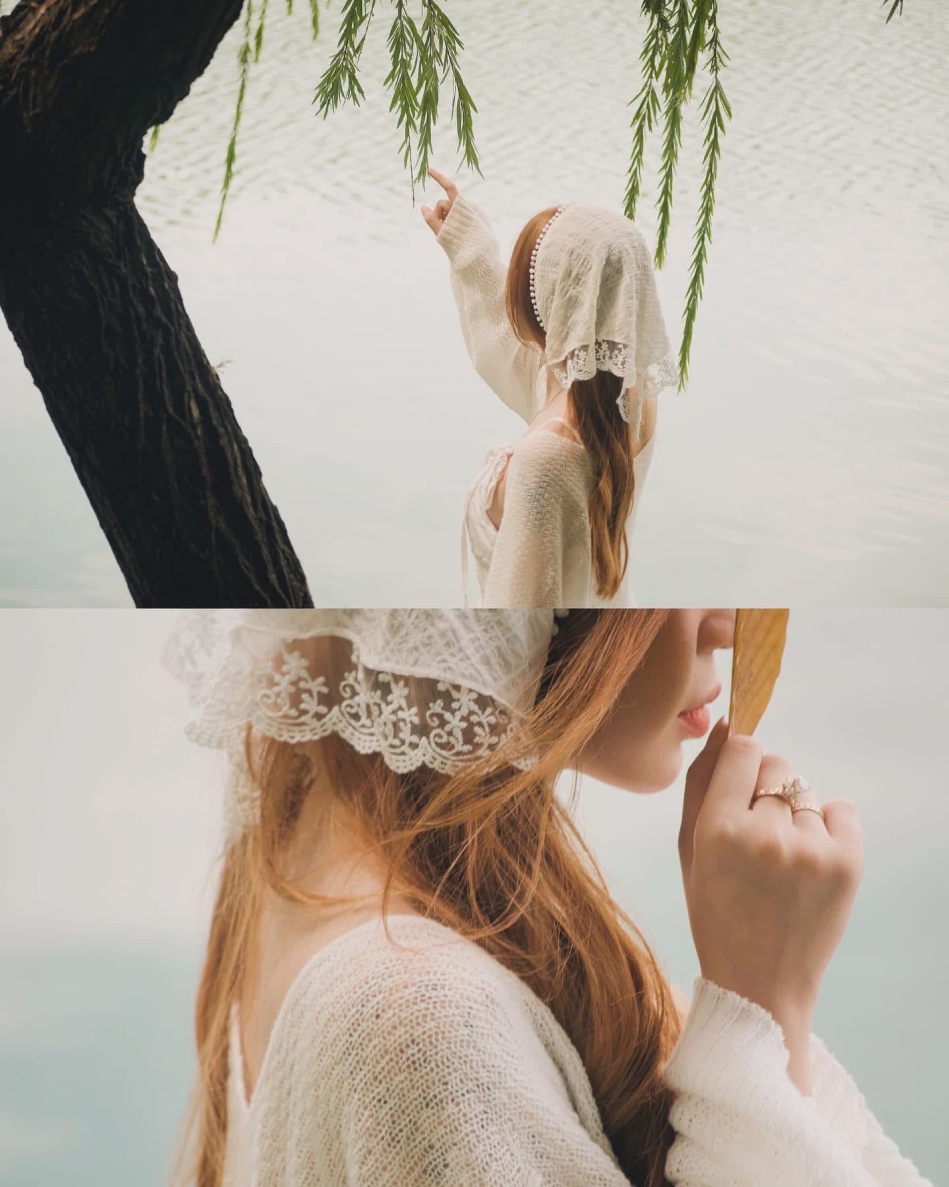 Dreamlike portrait beside a lake beneath willow branches