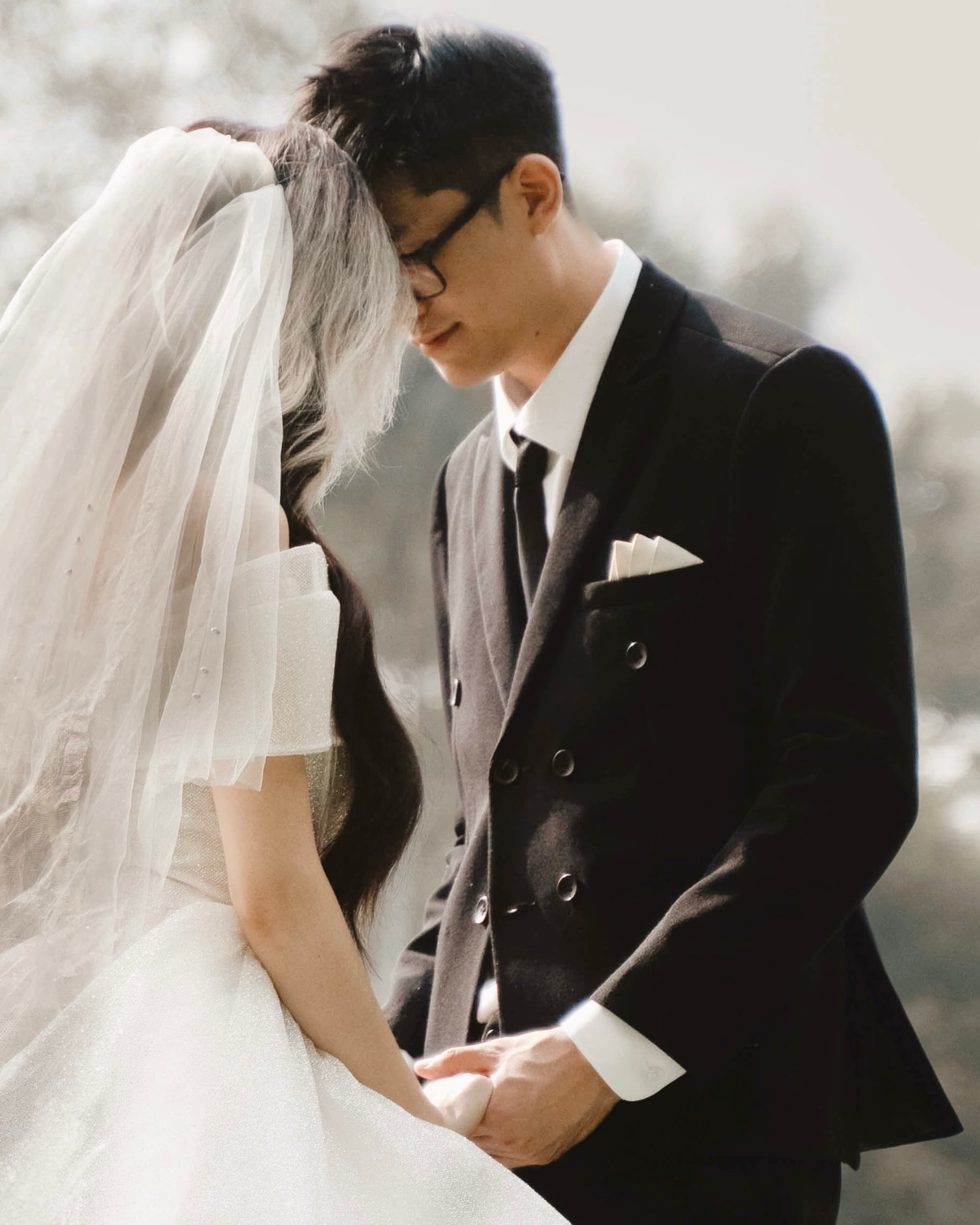 Bride and groom sharing a quiet moment outdoors